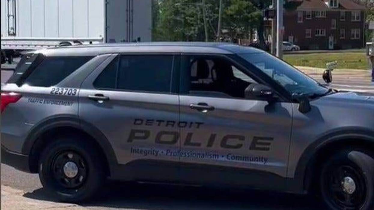 A Detroit Police traffic enforcement officer pulls out onto Gratiot Ave. to make a traffic stop.