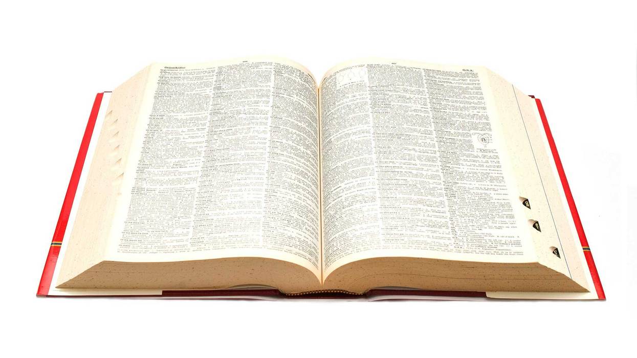 A dictionary open on a table.