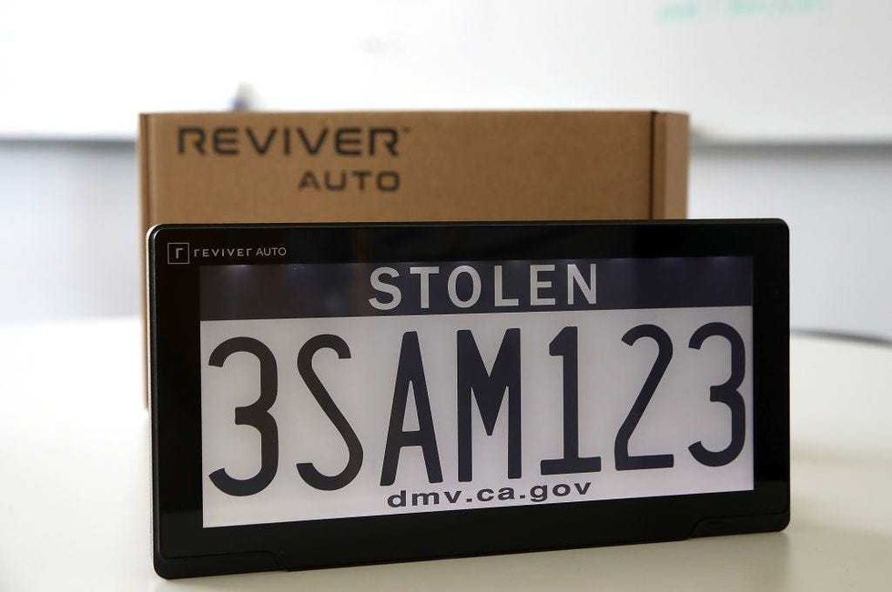 A digital license plate made by Bay Area company Reviver Auto, part of a pilot project with the state Department of Motor Vehicles, is displayed at Reviver Auto headquarters on May 30, 2018 in Foster City, California