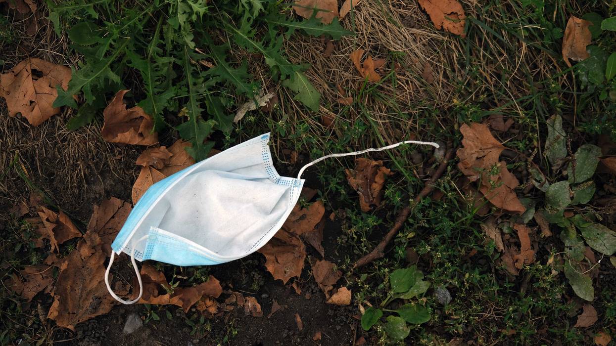 A discarded face mask lies on the ground outside of a hospital in a neighborhood that saw a significant number of COVID-19 cases early on in the pandemic on September 14, 2020 in the Brooklyn borough of New York City.