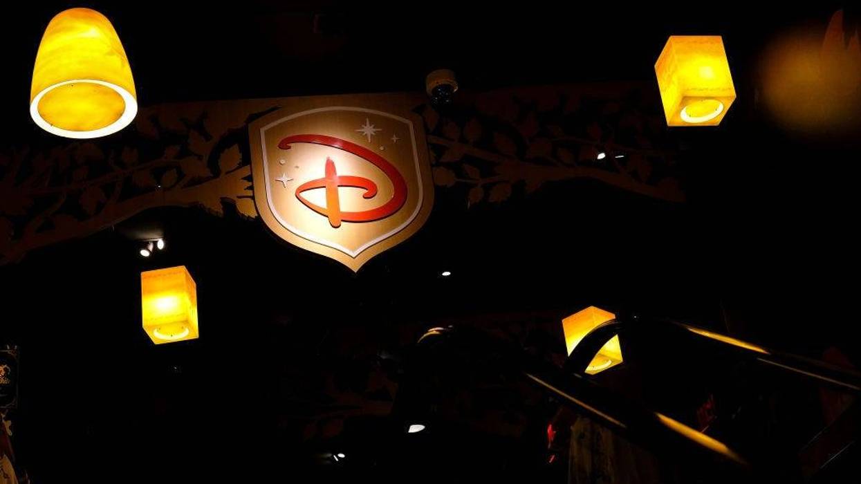 A Disney logo is displayed inside the Disney Store in Times Square