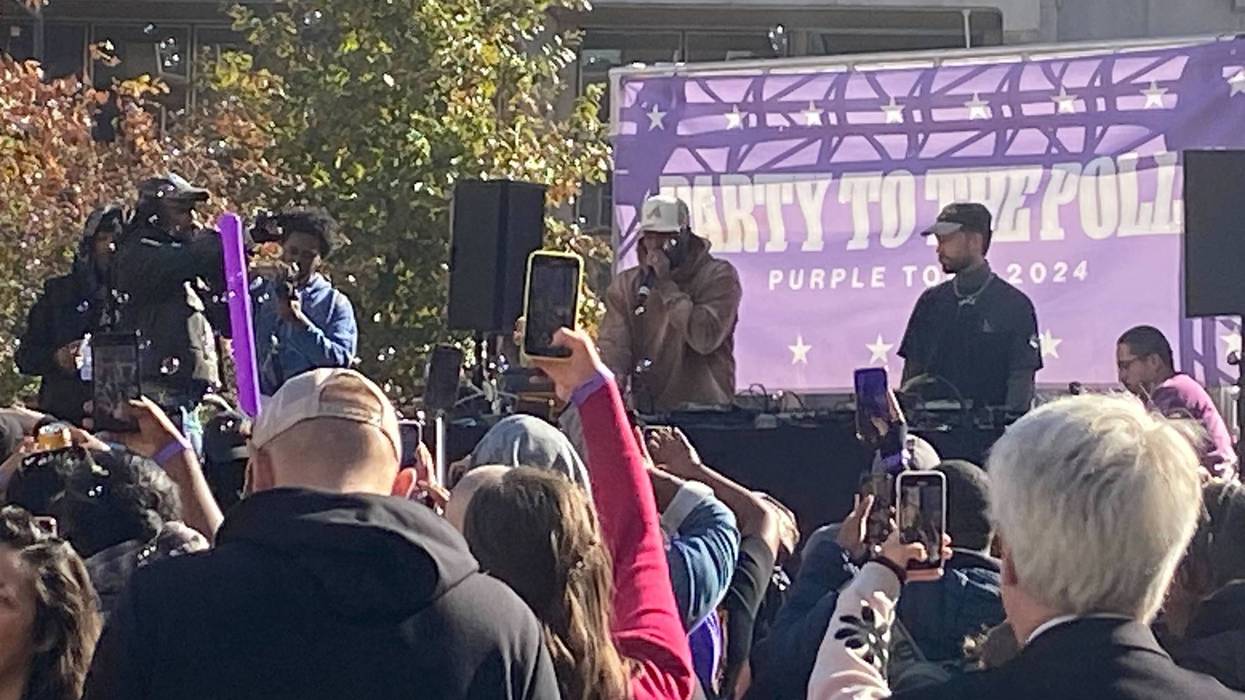 A DJ plays music and talks to the crowd gathered in LOVE Park on Tuesday for the dance party to the polls.