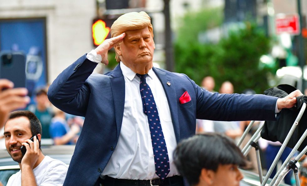 A Donald Trump impersonator performs outside Trump Tower in Manhattan on July 18, 2021 in New York City.
