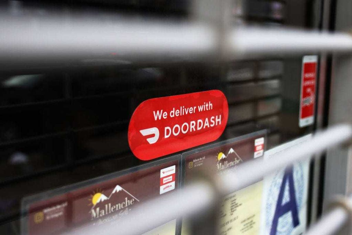 A Doordash sticker is seen on a window at Mallenche Mexican Grill in the Flatbush neighborhood of Brooklyn on December 04, 2020 in New York City.