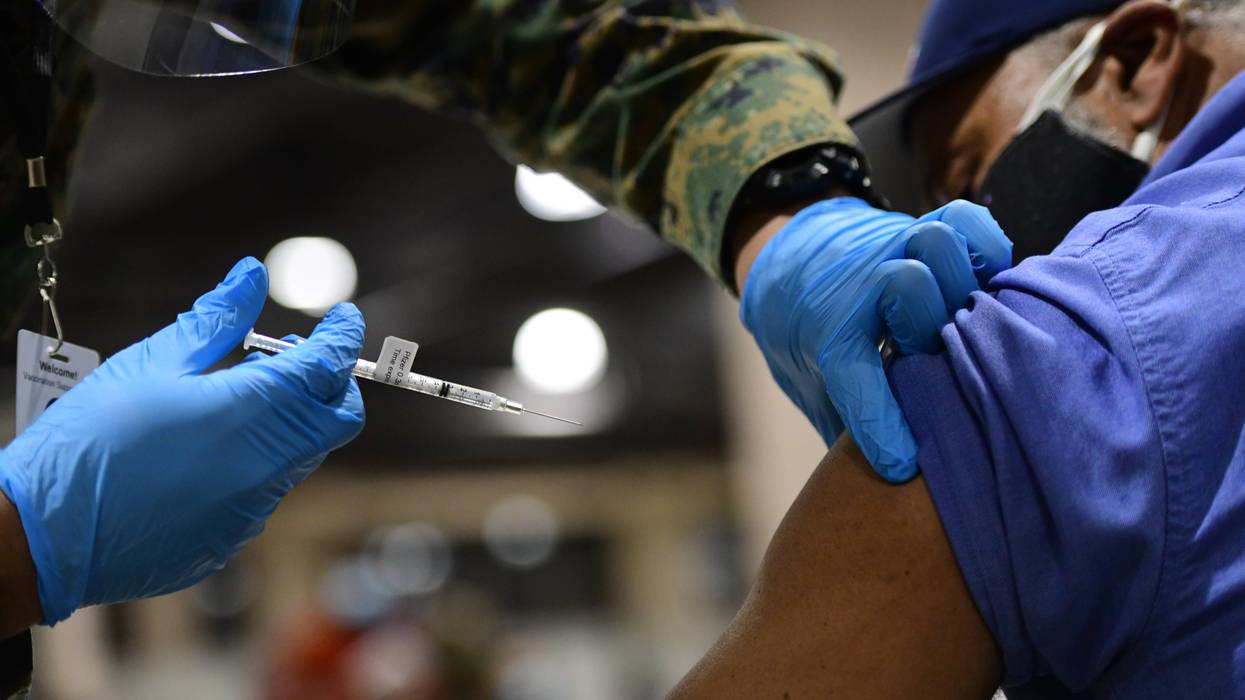 A dose of COVID-19 vaccine being administered at the Pennsylvania Convention Center in Philadelphia.