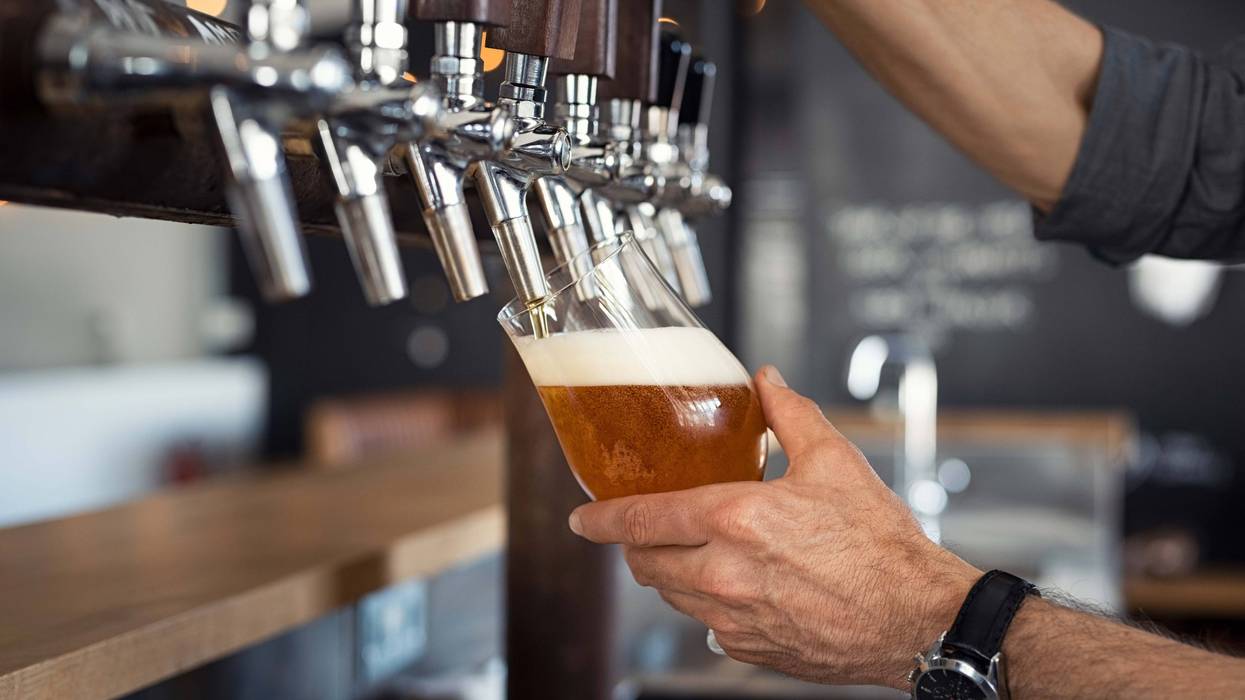 A draft beer pouring from a tap