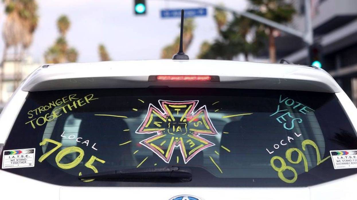 A driver displays their support for the IATSE union.