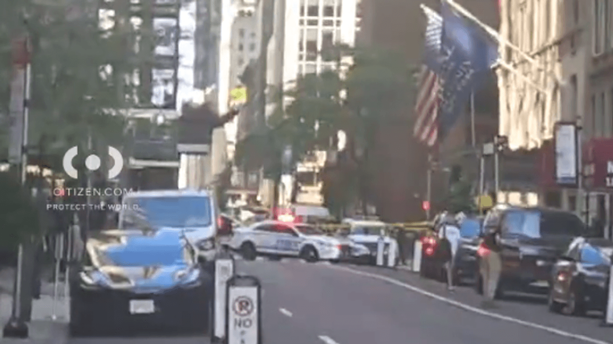 A driver was arrested in Midtown after crashing into several vehicles , including an NYPD cruiser.