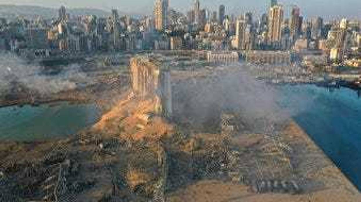 A drone picture shows the scene of an explosion at the seaport of Beirut, Lebanon, Wednesday, Aug. 5, 2020. (AP Photo/Hussein Malla)