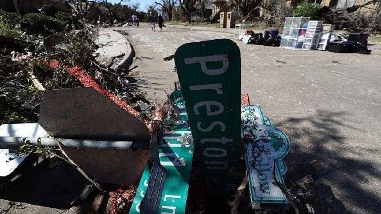 A fallen street sign in the Preston Hollow neighborhood on October 21, 2019 in Dallas, Texas. A tornado struck Sunday night causing major damage to homes, businesses and schools but no deaths or serious injuries have been reported.