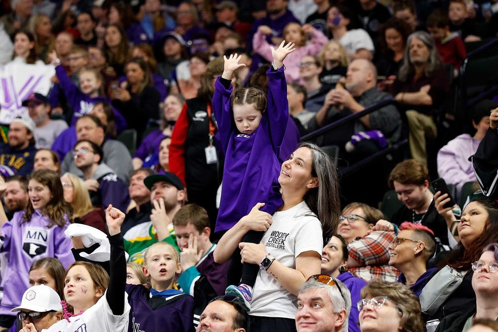 A fan cheers in the second period during Game Four of the 2024 PWHL Finals between Boston and Minnesota at Xcel Energy Center on May 26, 2024 in St Paul, Minnesota.
