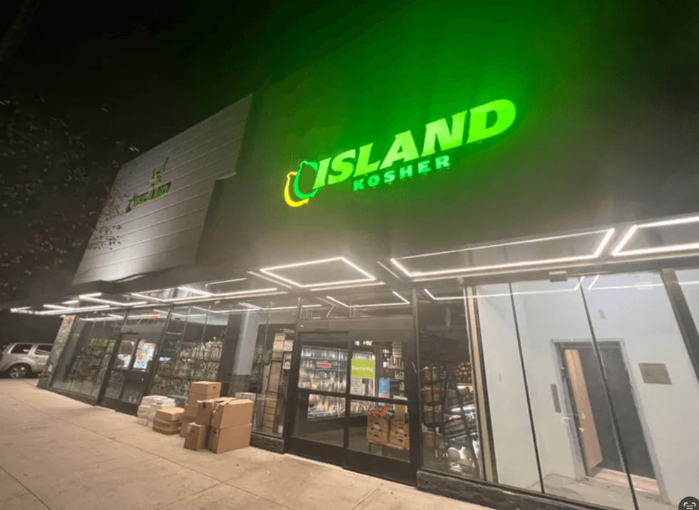 A father and his 7-year-old son were shot with BB gun pellets outside the Island Kosher grocery store Sunday.