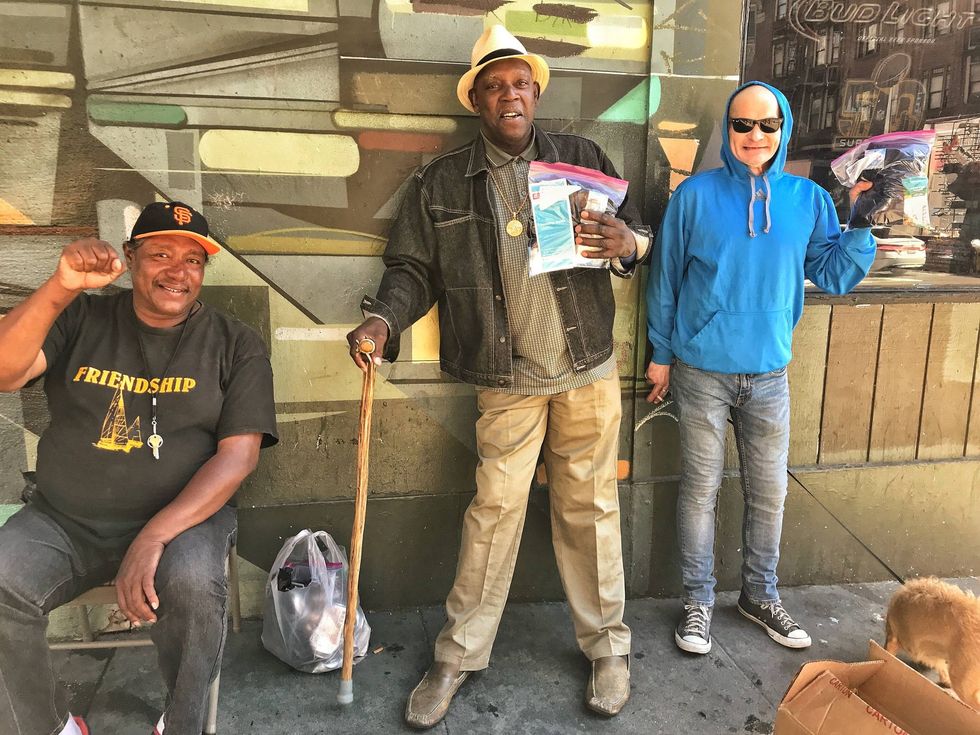 A few recipients of essential items provided by Blanket the Homeless.