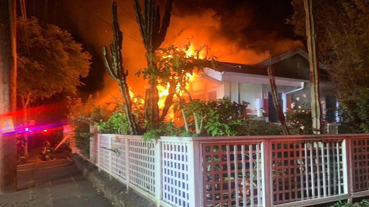 A fire burns early Monday morning on the 700 block of Buena Vista Avenue in Alameda.