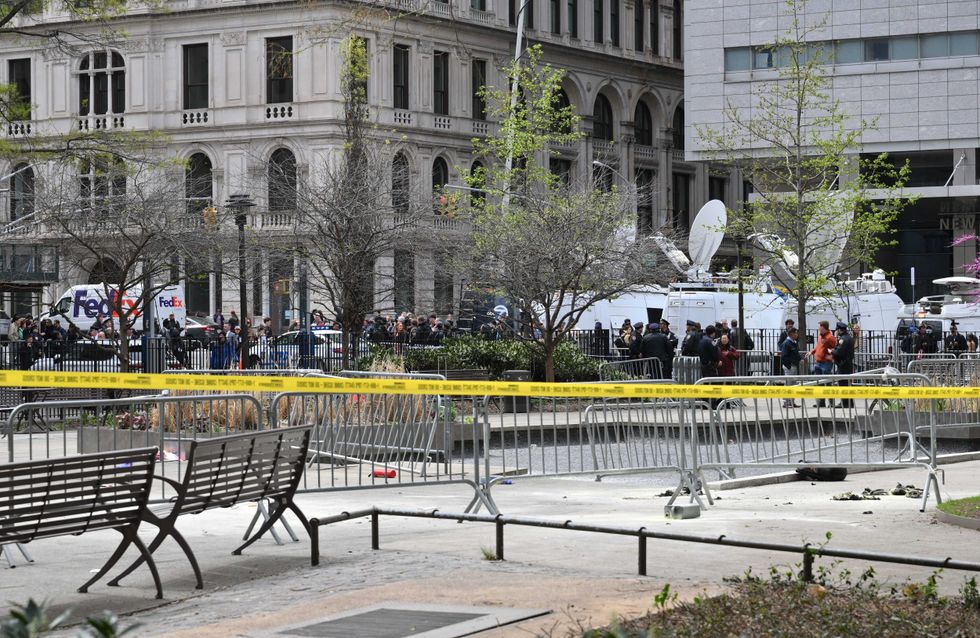 A fire extinguisher is left at the park across from Manhattan Criminal Court after a man reportedly set himself on fire during the trial of former President Donald Trump, on April 19, 2024.