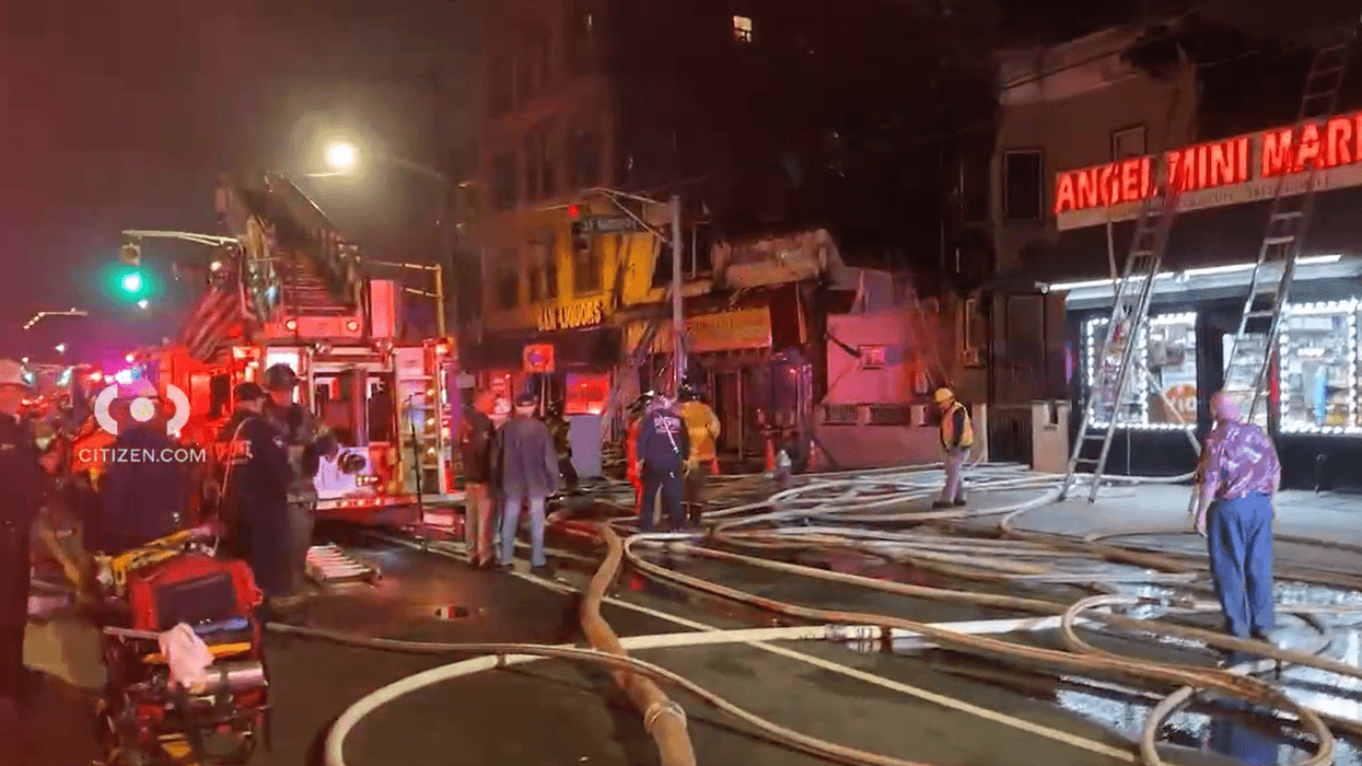 A fire spread from a Jersey City business to several residential buildings on Friday night, and firefighters responded to contain the blaze.