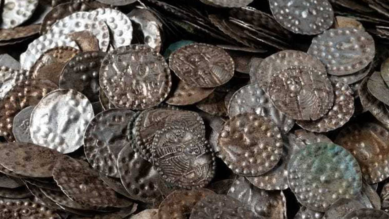 A fisherman in Sweden searching for bait worms near his summer cottage made a once-in-a-lifetime discovery — a massive medieval treasure hoard buried in the soil.