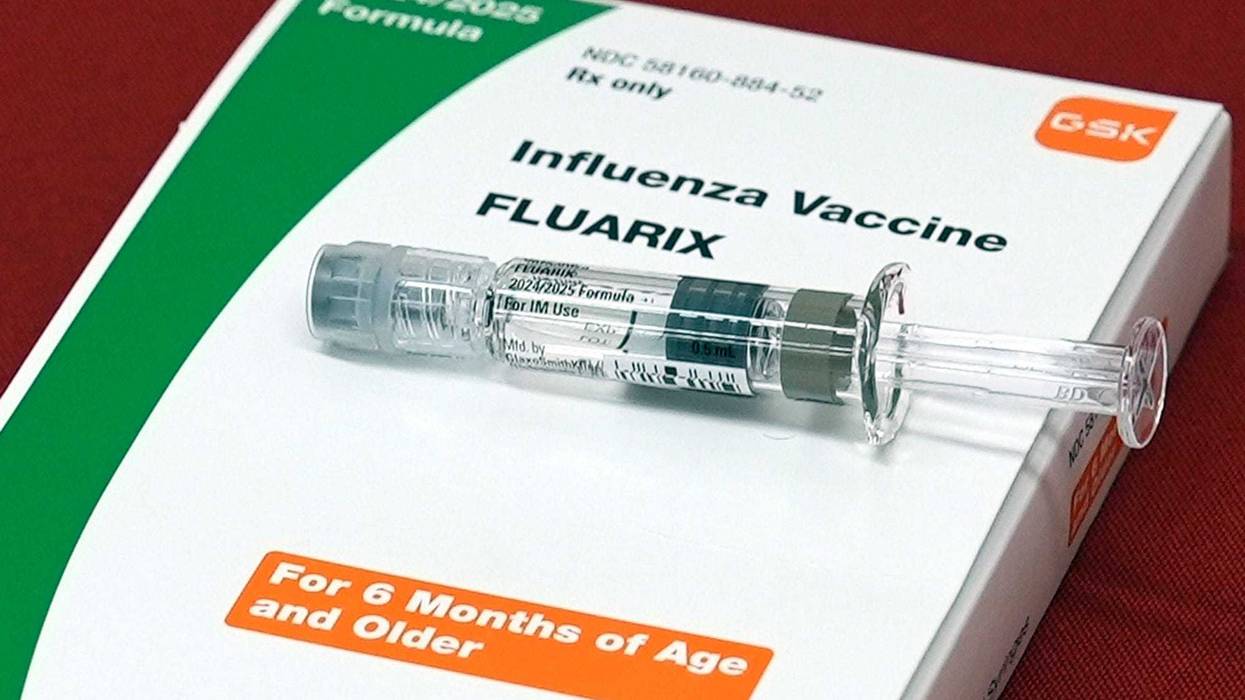 A flu vaccine is displayed at a pharmacy. The CDC reports the flu vaccination rate for U.S. children has plummeted from about 64% five years ago to 49% this season