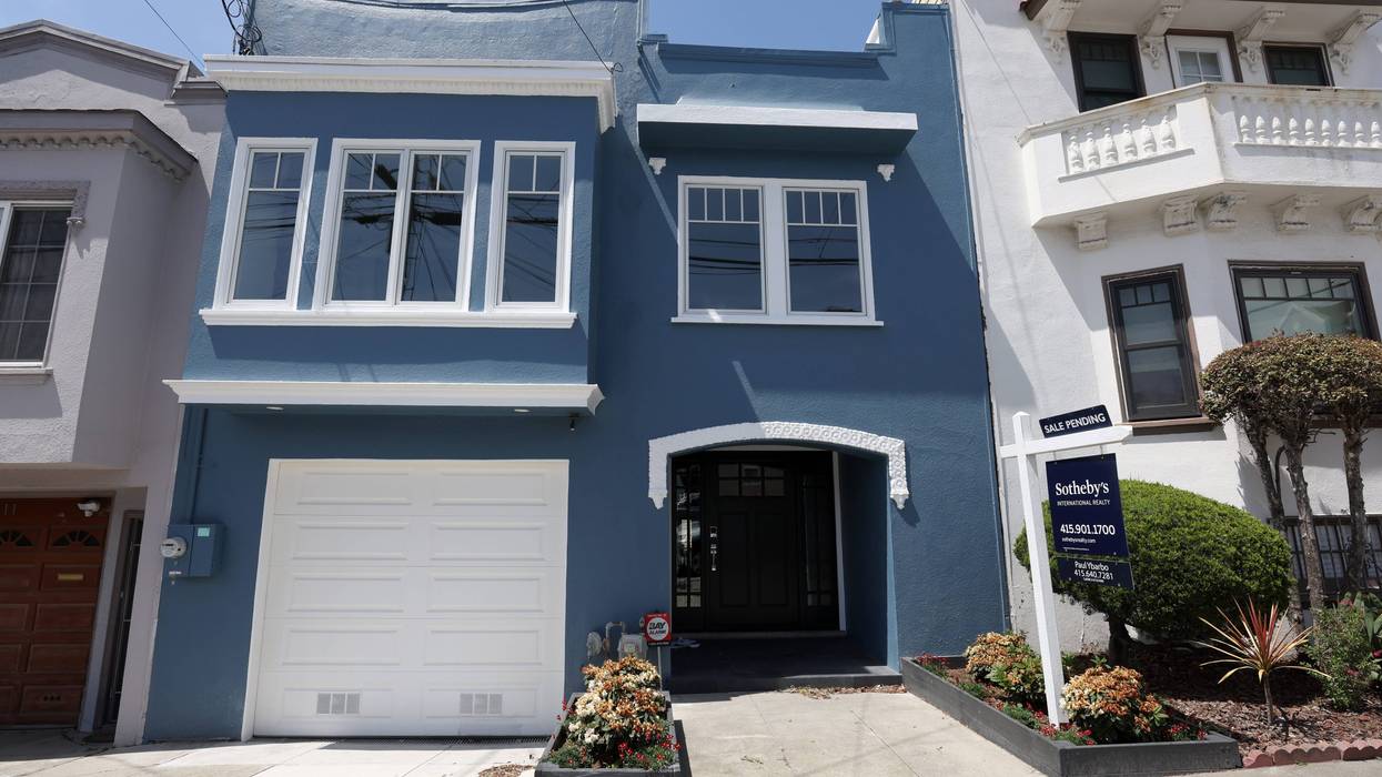 A for sale sign is posted in front of a home that is listed for over $1 million on April 29, 2022 in San Francisco, California.