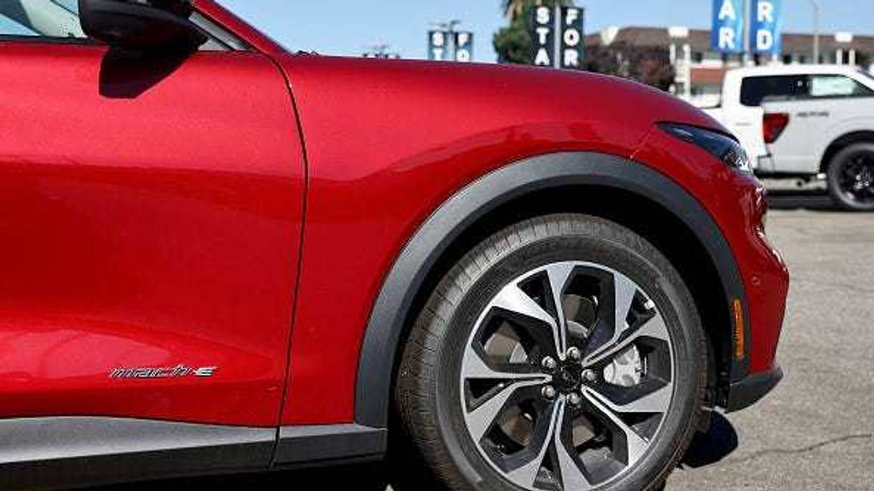 A Ford Mustang Mach-E electric vehicle is displayed for sale at a Ford dealership on August 21, 2024 in Glendale, California.