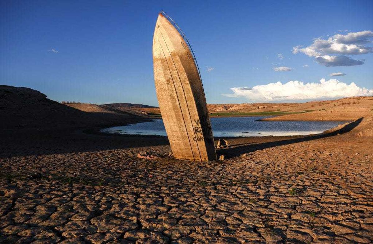 A formerly sunken boat is currently stuck nearly upright in a now-dry section of lakebed at the drought-stricken Lake Mead on June 23, 2022 in the Lake Mead National Recreation Area, Nevada.