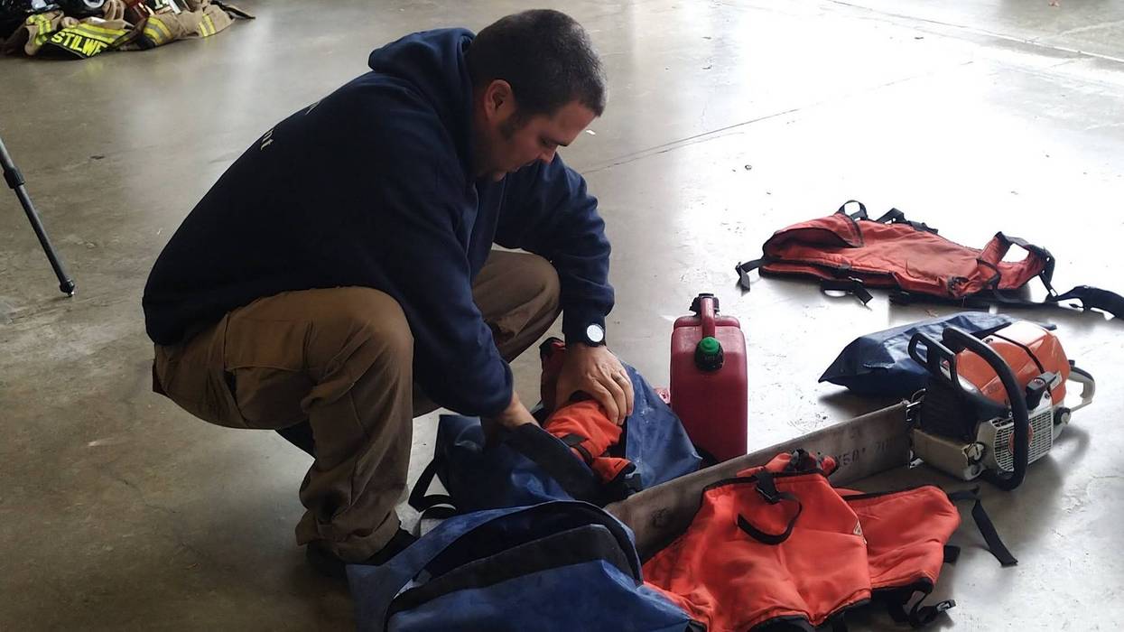 A Fort Worth firefighter prepares to help fight the Eastland Complex wildfire on Friday, March 18, 2022.