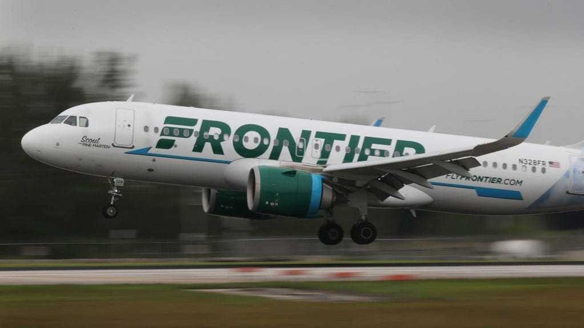 A Frontier airlines plane lands at the Miami International Airport on June 16, 2021 in Miami, Florida.