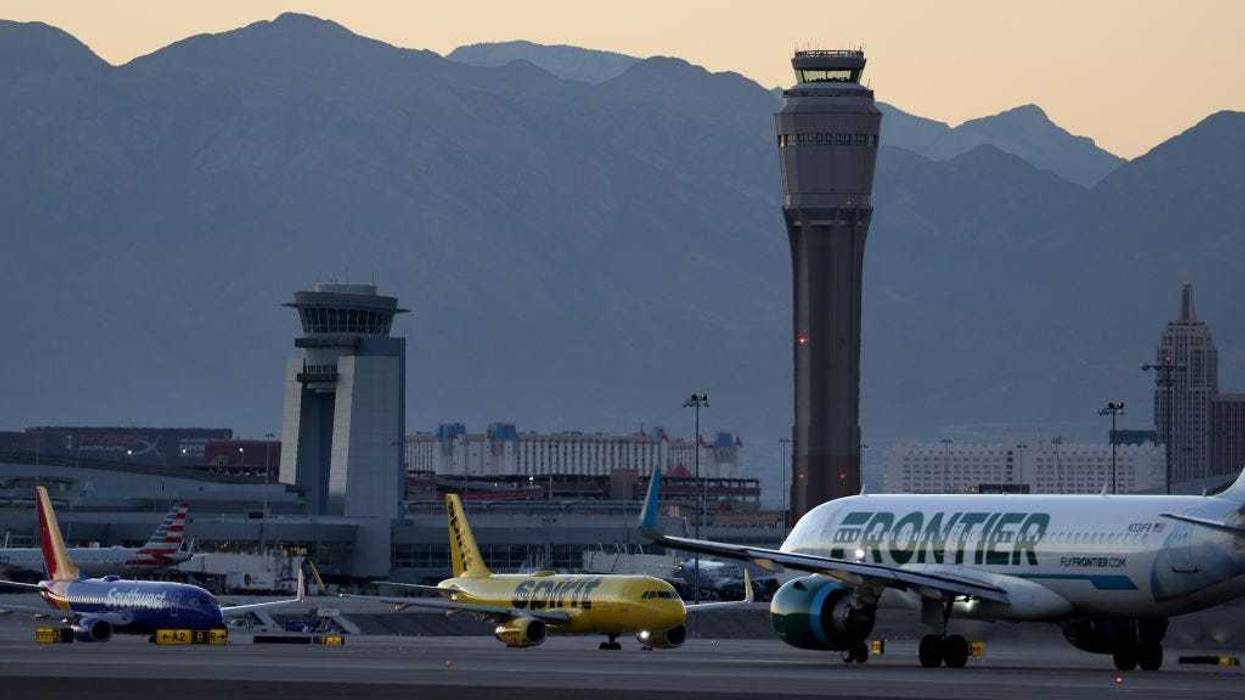A Frontier Airlines plane prepare to take off from Harry Reid International Airport as Southwest Airlines and Spirit Airlines planes taxi on October 14, 2022 in Las Vegas, Nevada.