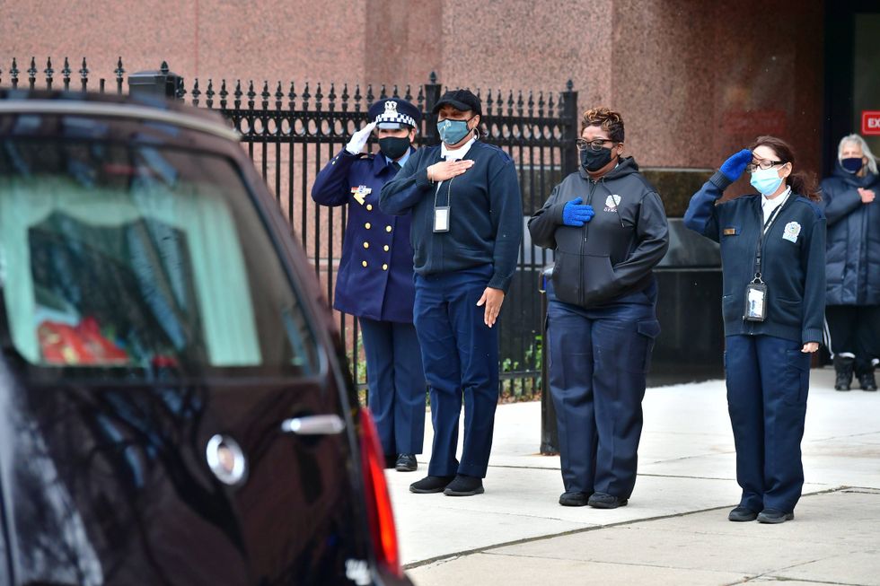A funeral mass was this morning for a Chicago 911 dispatcher who died this month of COVID-19 and he was given a reverential tribute by fellow workers.