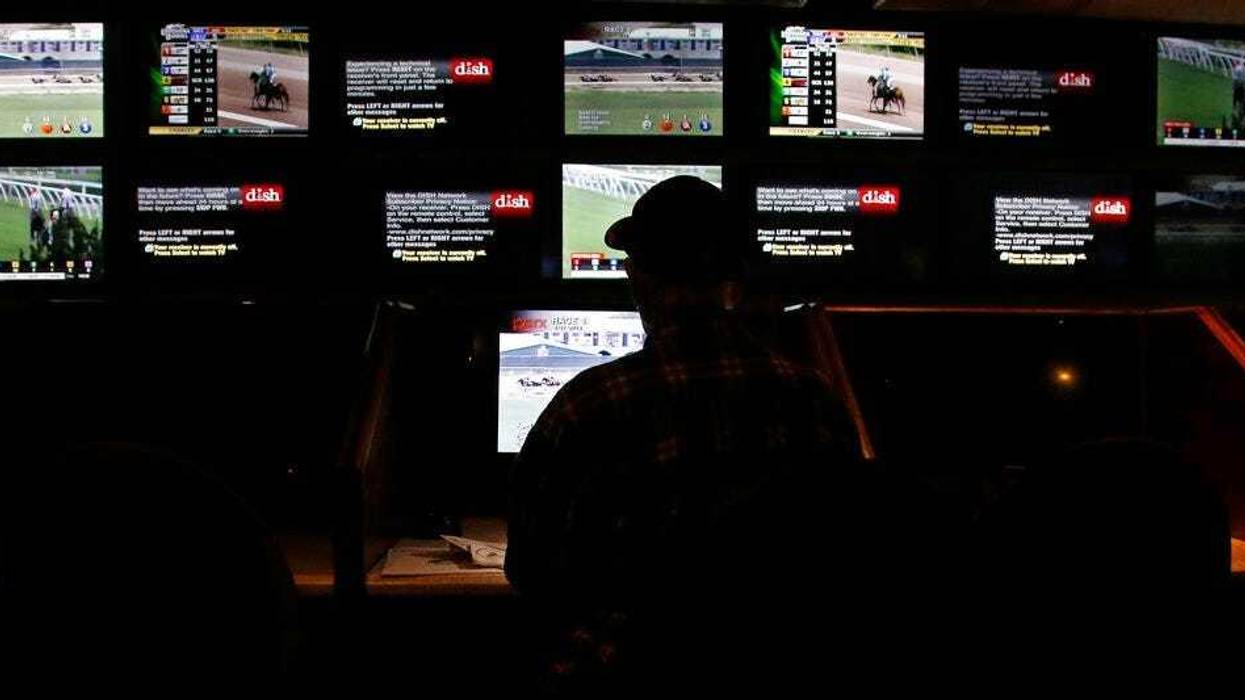 A gambler places a sports bet at Resorts Casino in Atlantic City, New Jersey. Numerous U.S. states are considering joining the seven that currently offer legal sports betting.