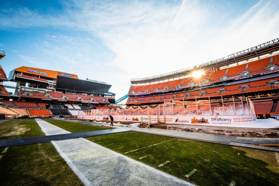 A general view as workers put the finishing touches on the hockey rink installed at FirstEnergy Stadium for the
