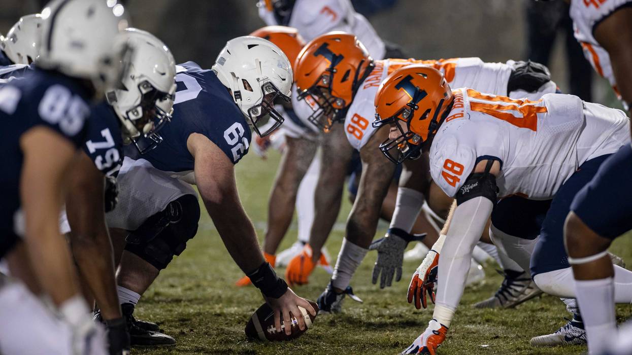 A general view of the line of scrimmage as Michal Menet #62 of the Penn State Nittany Lions prepares to snap the ball against the Illinois Fighting Illini defense during the second half at Beaver Stadium on December 19, 2020 in State College, Pennsylvania.