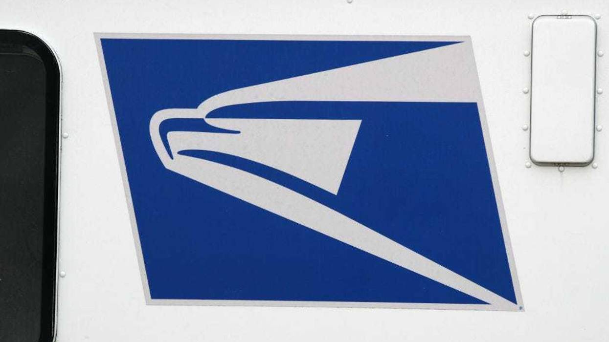 A general view of United States Postal Service trucks on April 12, 2020 in Farmingdale, New York. The USPS requested $75B in government assistance on April 9 to help recover from a large drop in mail volume. (Photo by Bruce Bennett/Getty Images)