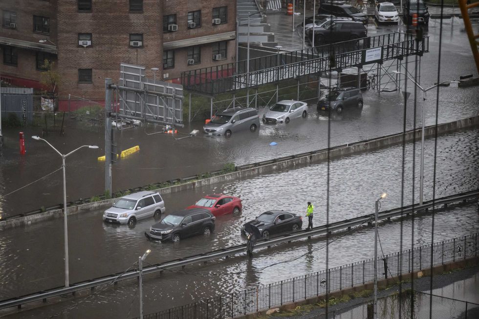 A general view shows cars stranded in floodwater on the FDR Drive in Manhattan on September 29, 2023