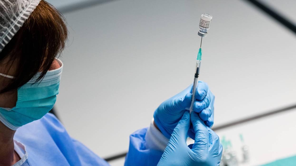A German nurse prepares syringes that contain the Pfizer/BioNTech vaccine.