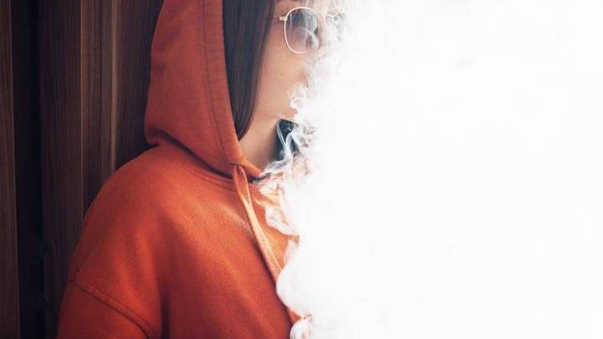 A girl vaping.