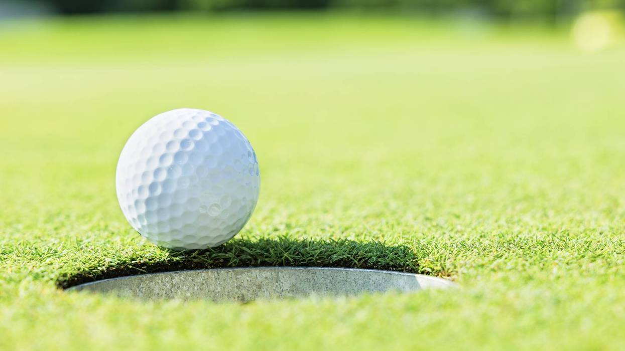 A golf course with beautiful fresh green grass