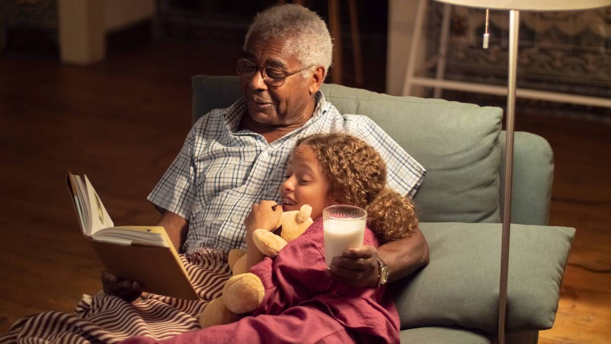A grandfather telling his grandfather a story.