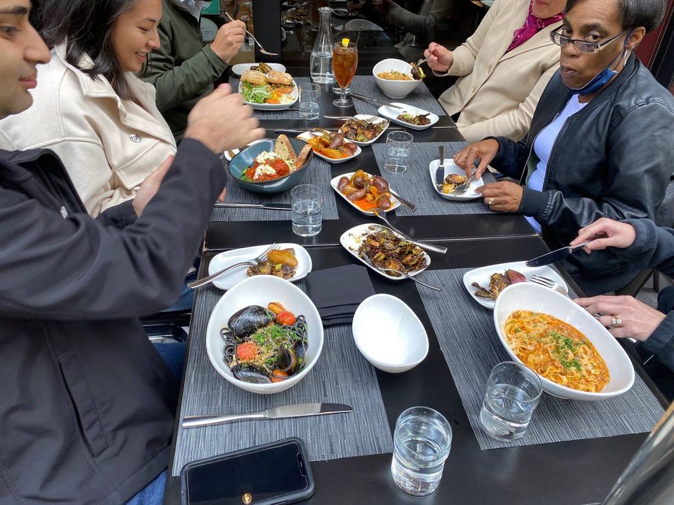 A group eating a Barbacco in San Francisco.