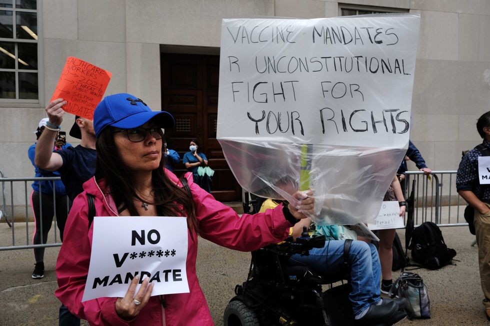 A group of anti-vaccination protesters gather outside of New York-Presbyterian Hospital on September 1, 2021