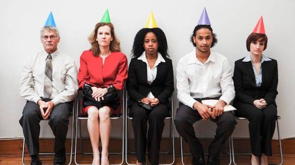 A group of business colleagues sitting awkwardly at an office party