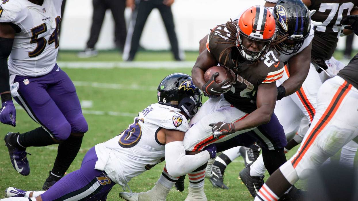 A group of Ravens tackle Browns RB Kareem Hunt during Baltimore's season opening beatdown of Cleveland in September.