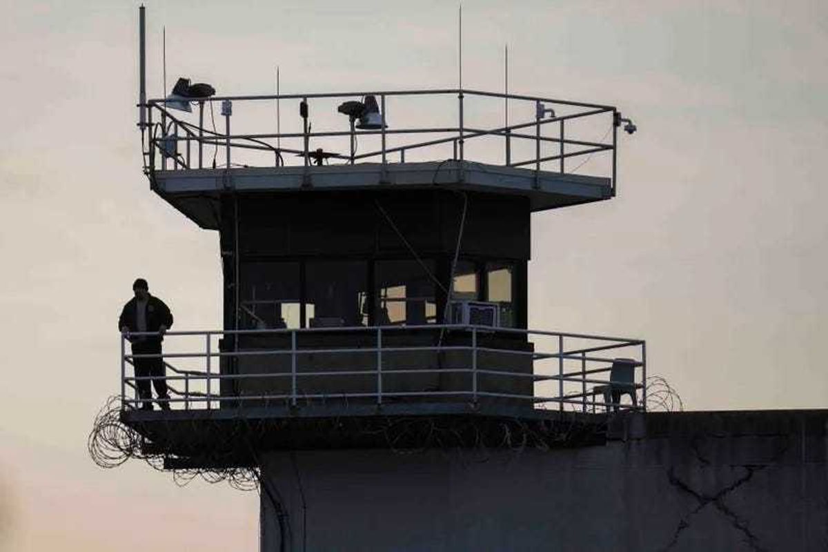 A guard stands in a tower at Indiana State Prison