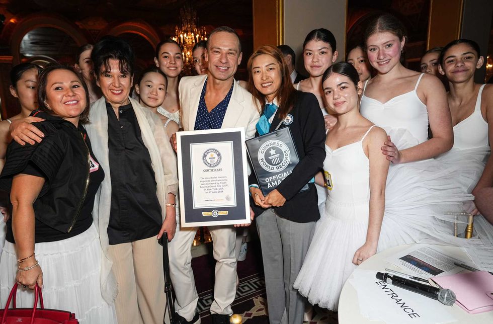 A Guinness World Record representative presents Sergey Gordeev and the Youth America Grand Prix with the Guinness World Record for Most Ballerinas En Pointe Simultaneously at The Plaza Hotel on April 17, 2024 in New York City.