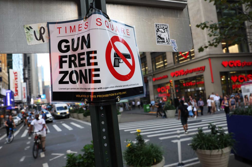 A "Gun Free Zone" sign is seen posted on 40th Street and Broadway on Aug. 31, 2022 in New York City