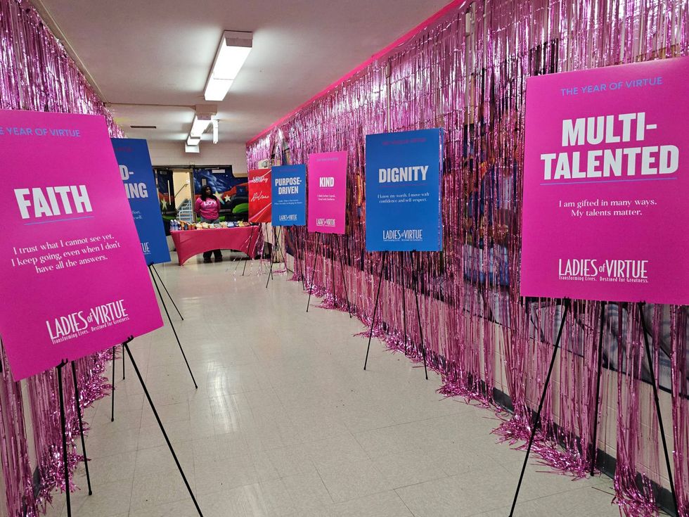 A hallway at Woodson North Middle School in Bronzeville is decorated with colorful affirmations for girls and young women. Valentine