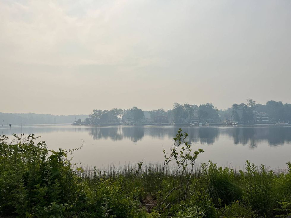 A haze of smoke is visible over the Mullica River on Monday, June 20, 2022.