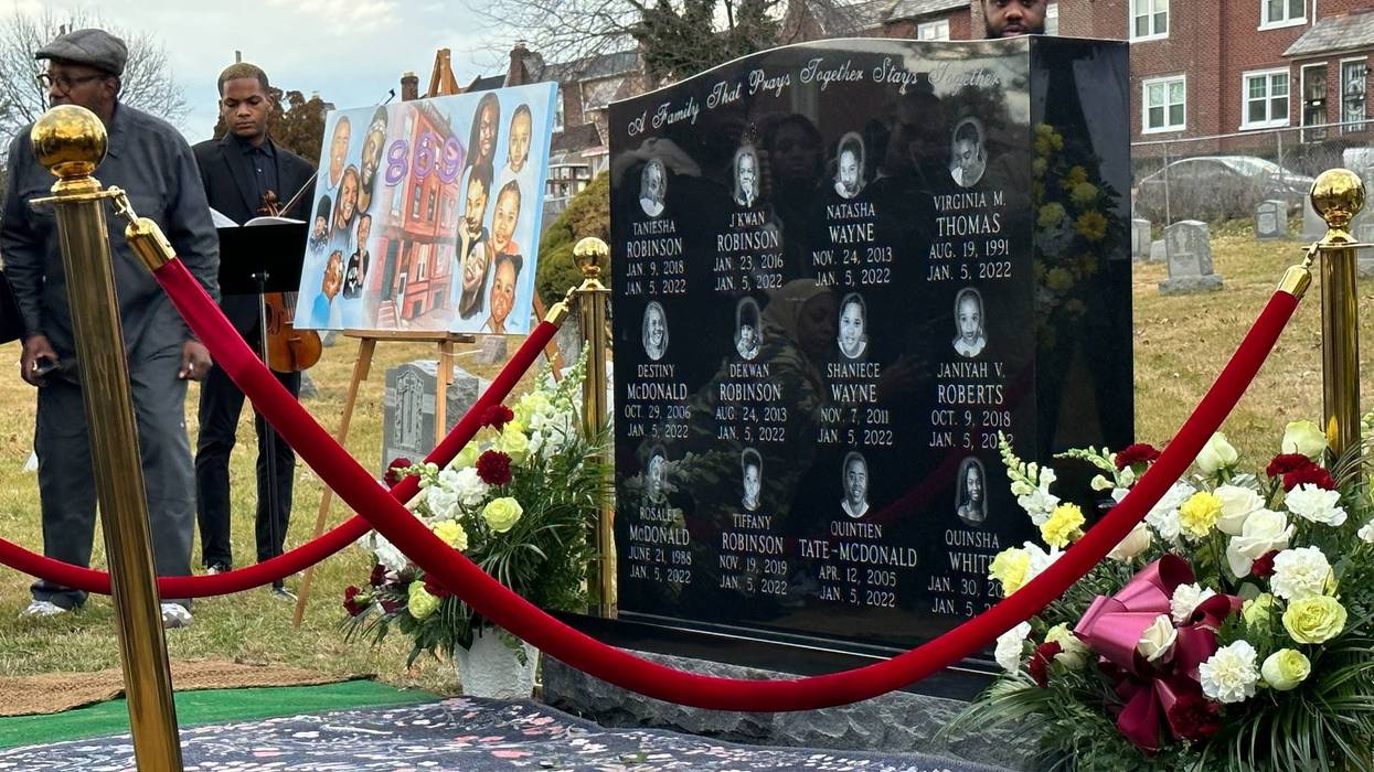A headstone was put in place Thursday at Chelten Hills Cemetery in East Mount Airy to remember the 12 victims of the Fairmount Fire on Jan. 5, 2022.