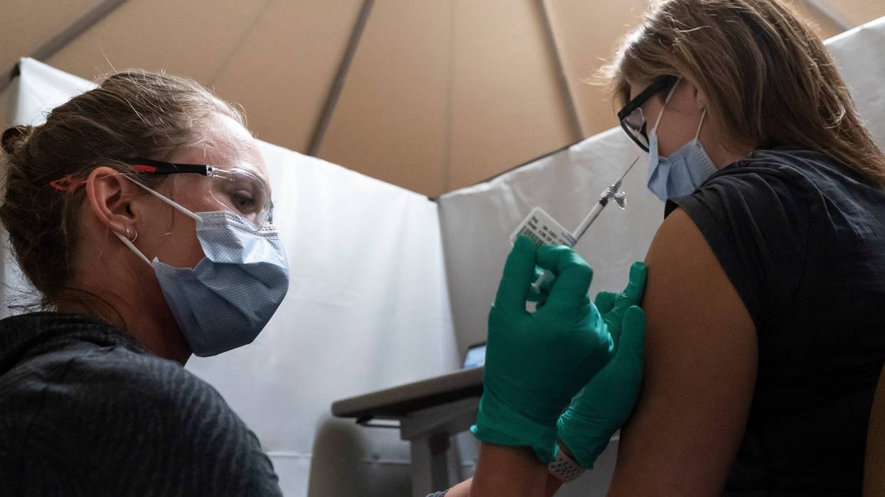 A healthcare worker at the Portland Veterans Affairs Medical Center receives a COVID-19 vaccination on December 16, 2020 in Portland, Oregon. The first rounds of Pfizer's vaccine were administered in Oregon on Wednesday.
