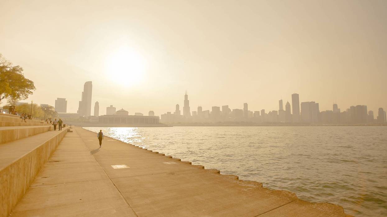 A heat wave and smog on the shoreline of a cityscape